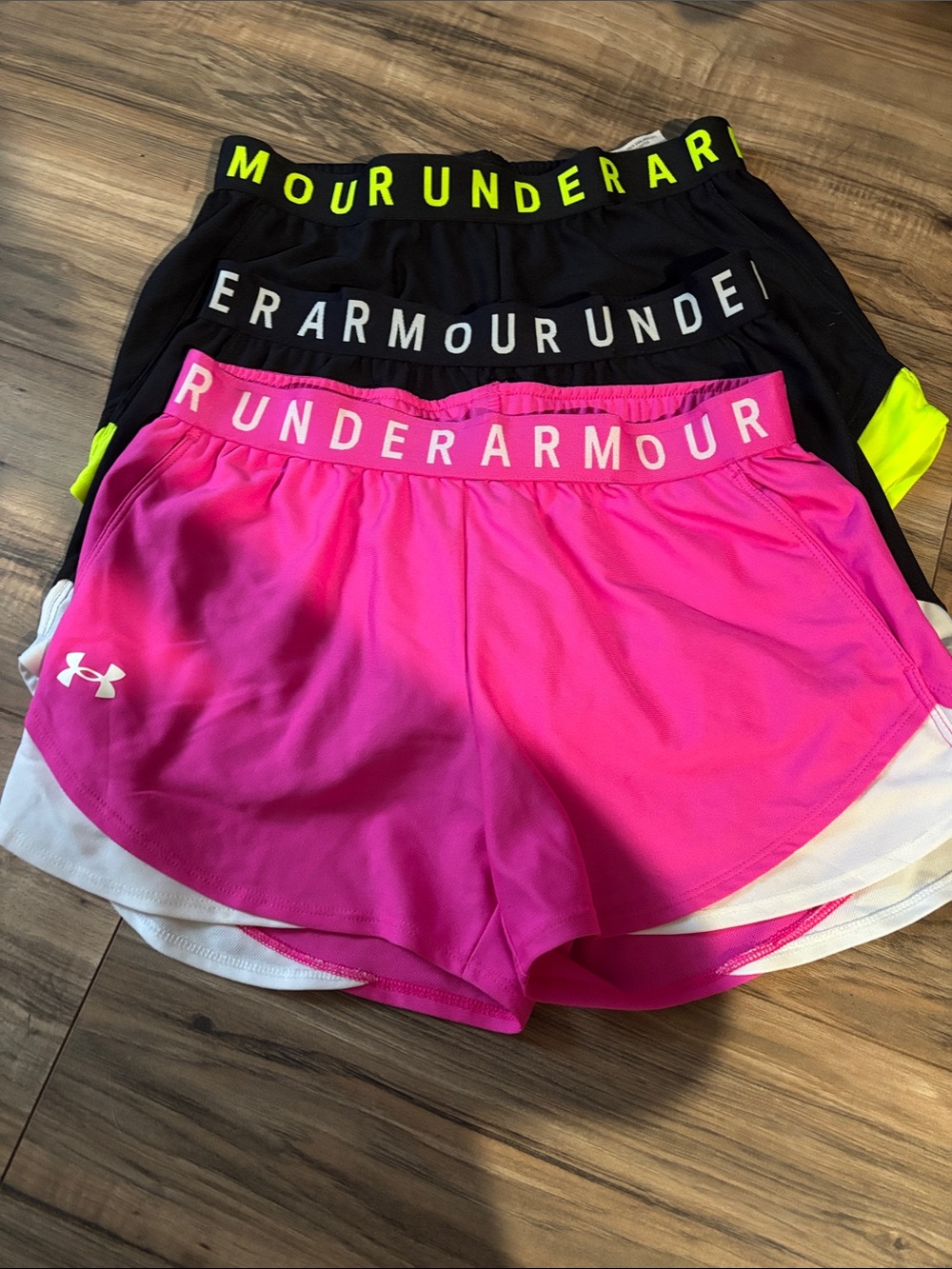 3 pair of Under Armour Women’s Athletic Shorts. Pink is small and blacks are xs